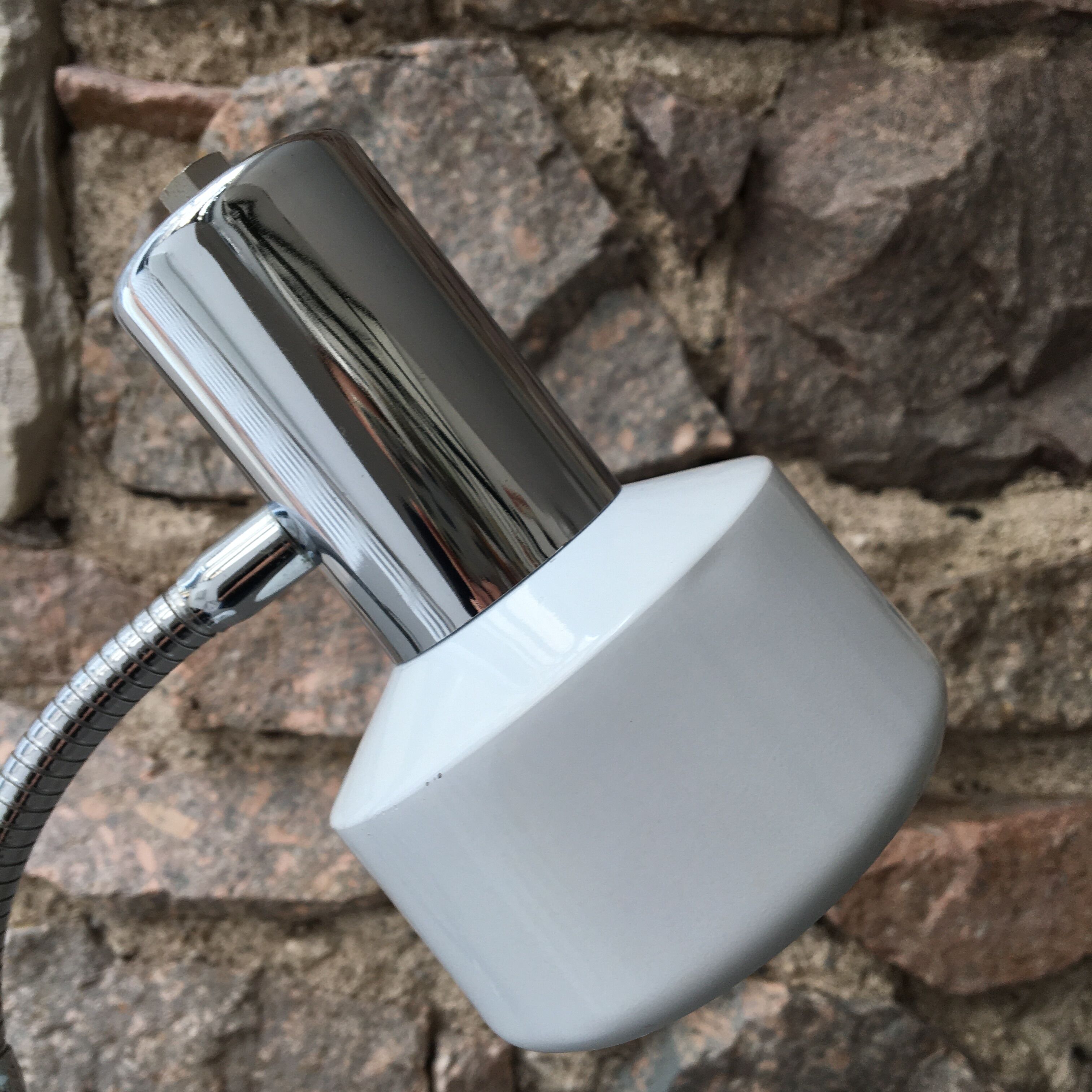 flexible white and stainless steel desk lamp