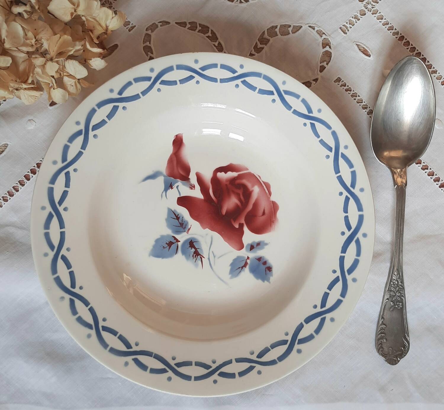 Mismatched old soup plates accompanied by a soup tureen