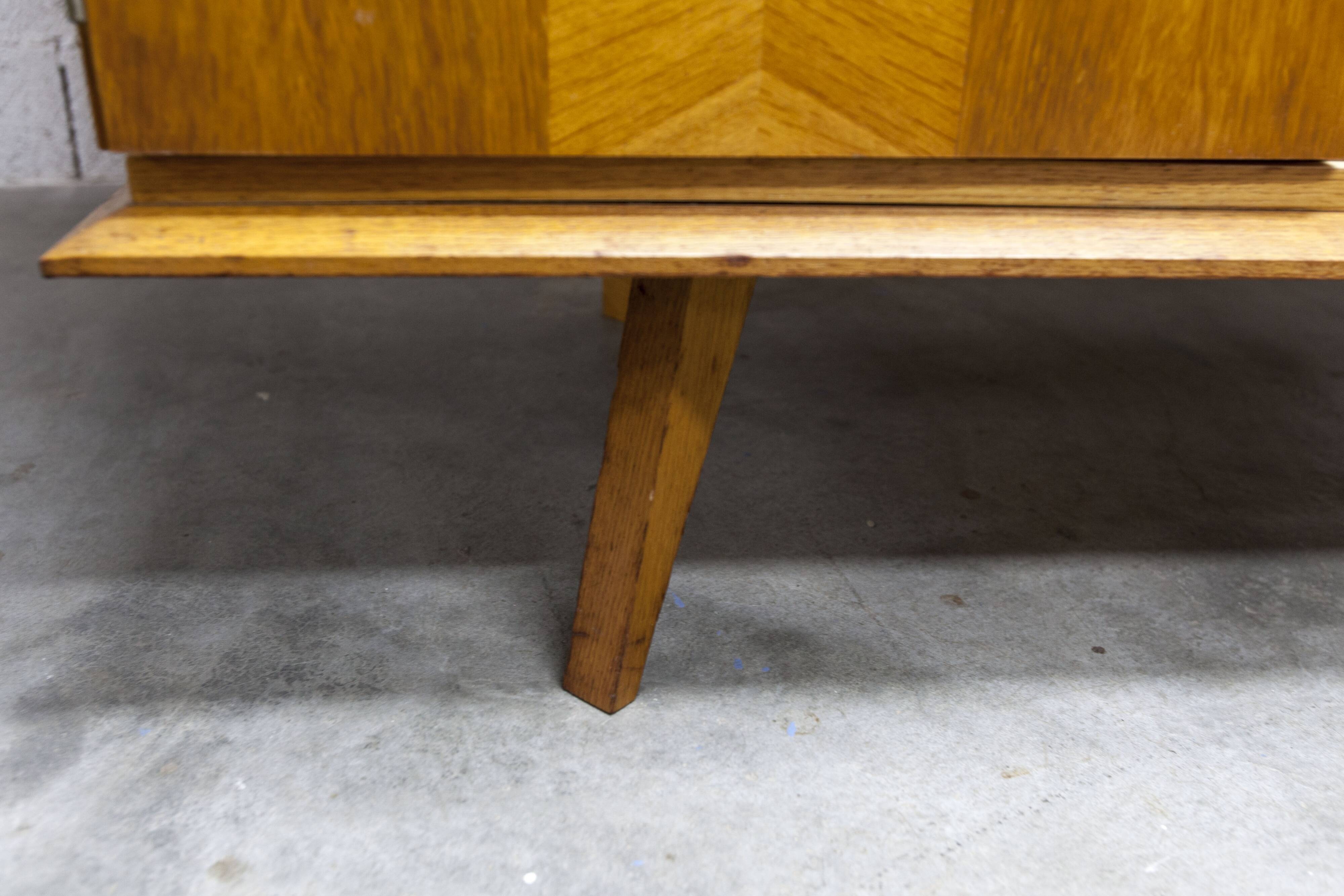 French wardrobe with tapered legs, 3 doors, 1 mirror (27*130), and 1 drawer.