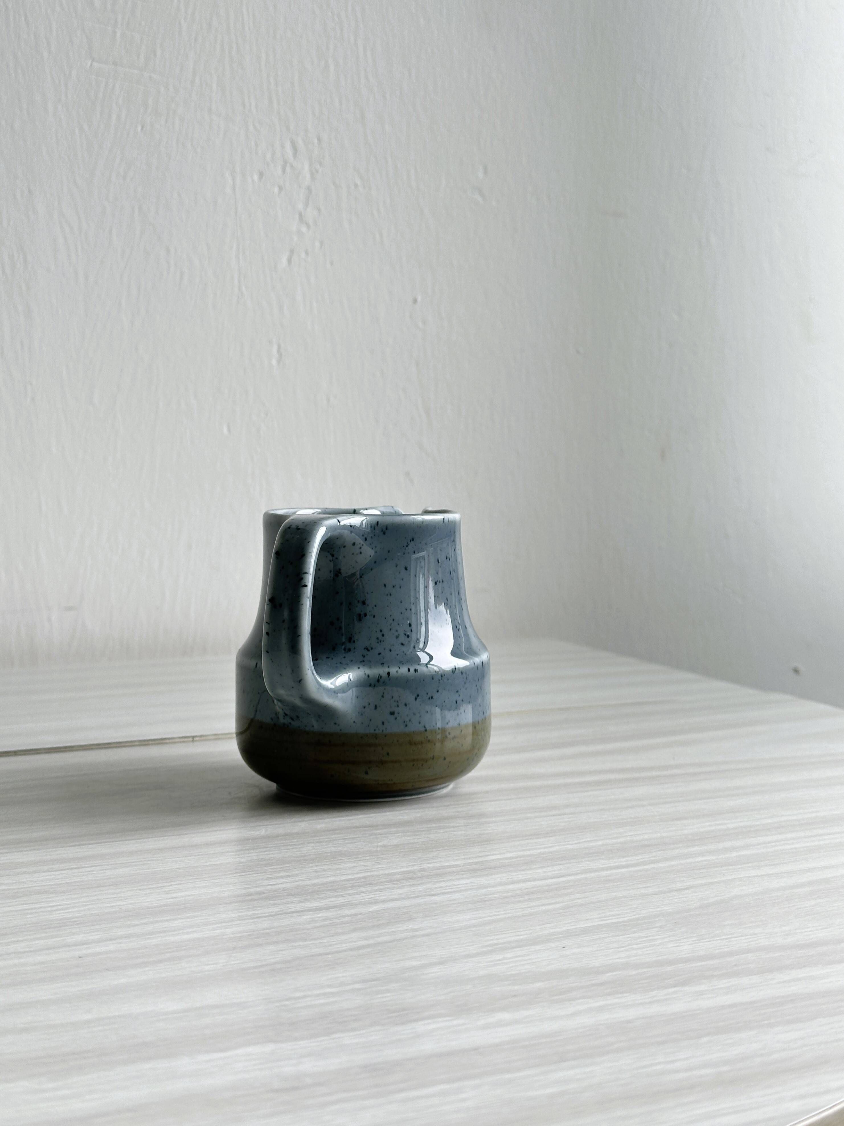 Blue and beige ceramic milk jug