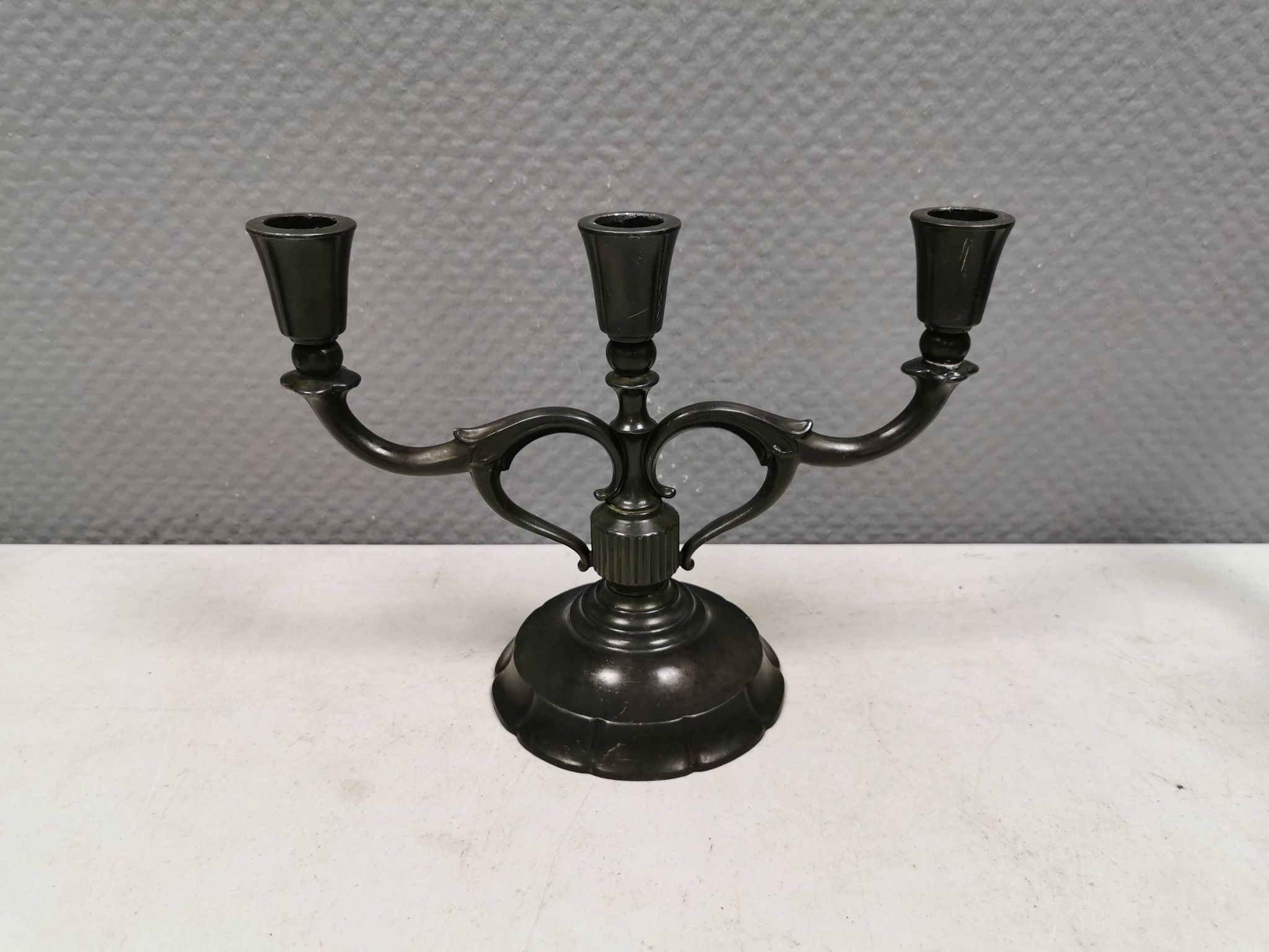 Three-armed candlesticks by Just Andersen, in Disco metal, Denmark, 1950s
