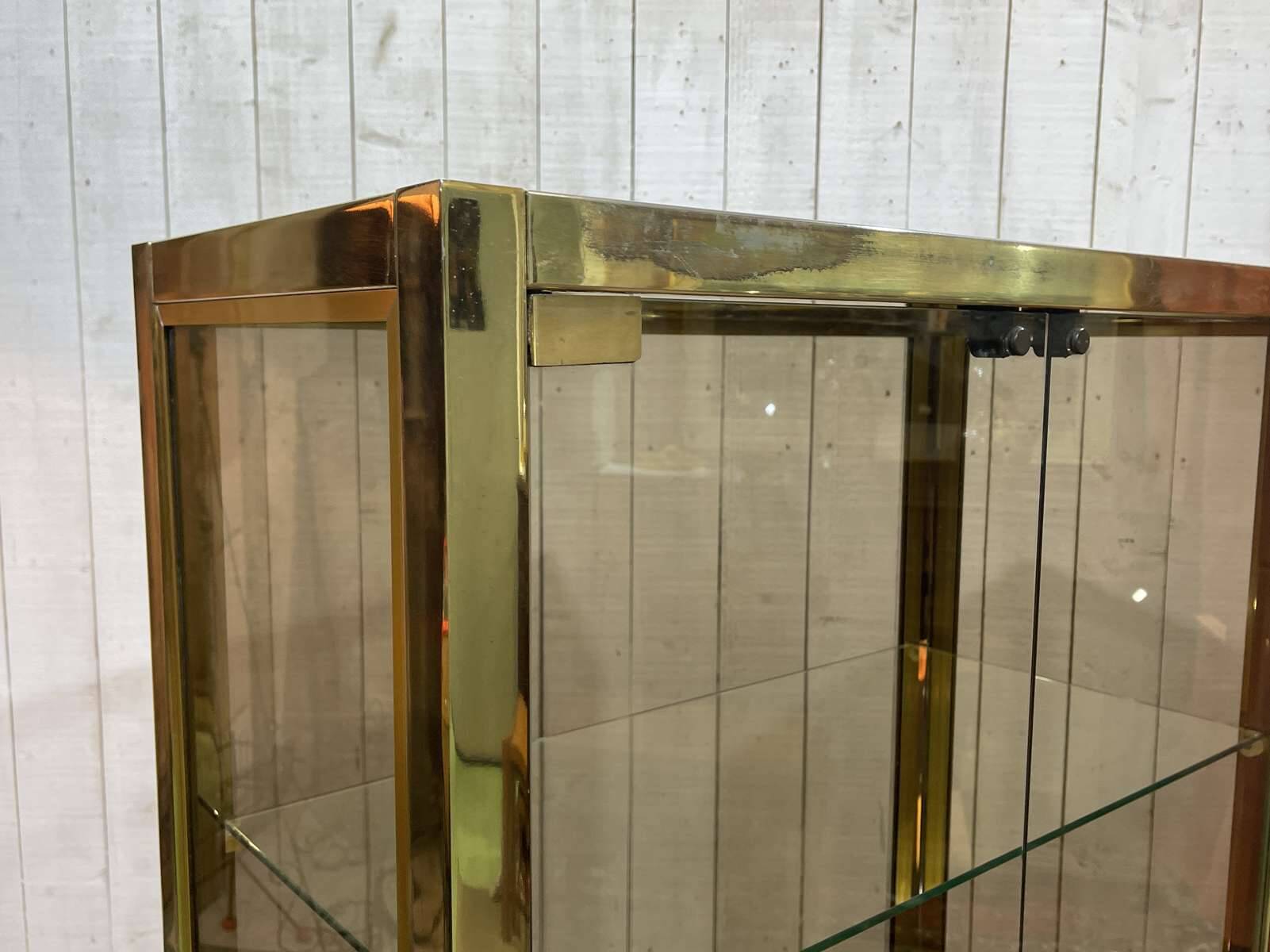 Exhibition showcase in gold-plated chrome and smoked glass - work from the 1980s.