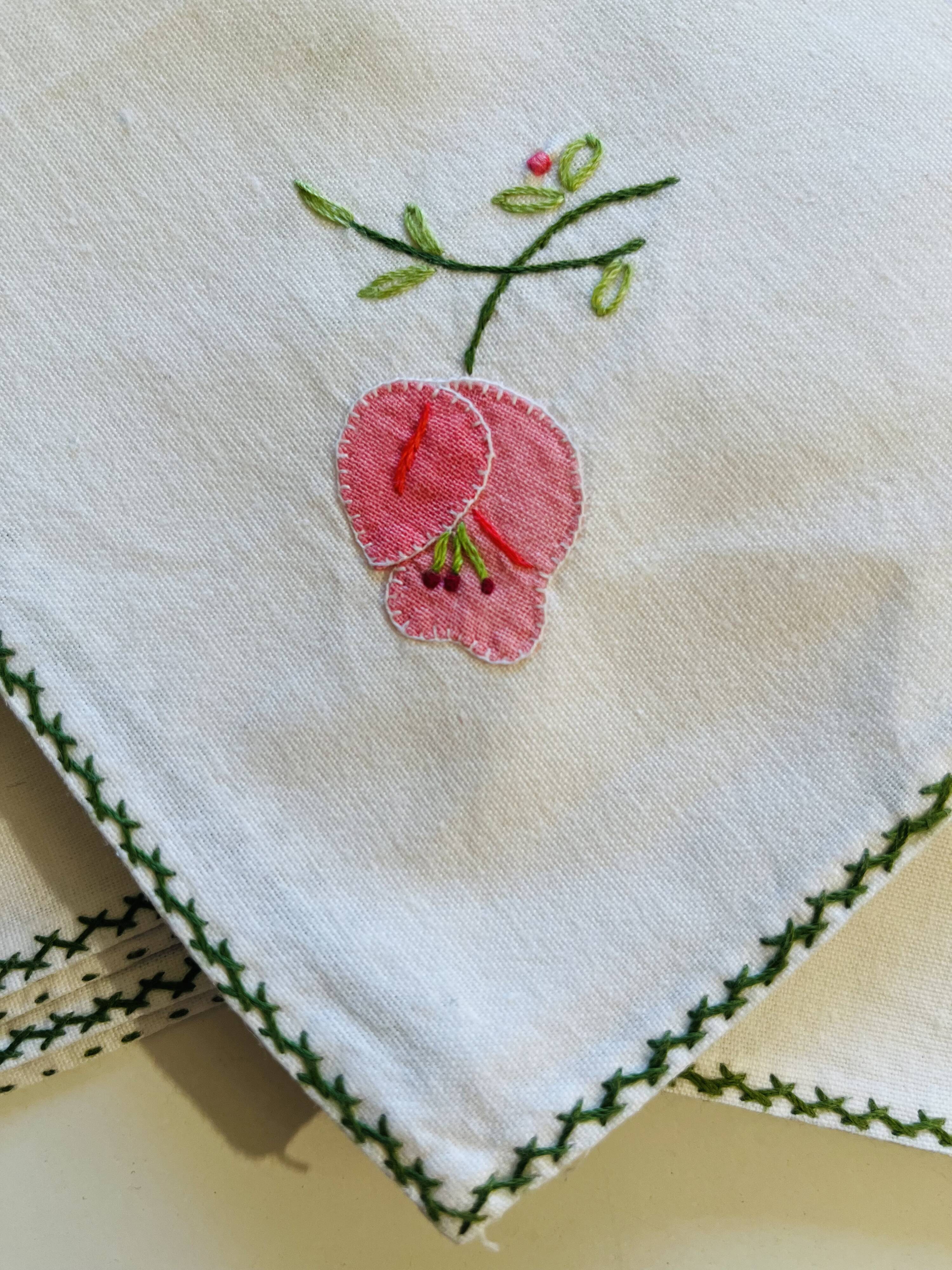 Set of 12 vintage hand-embroidered cotton white napkins.