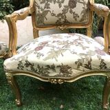 Pair of straight-backed armchairs, known as "queen's armchairs," in carved and gilded wood