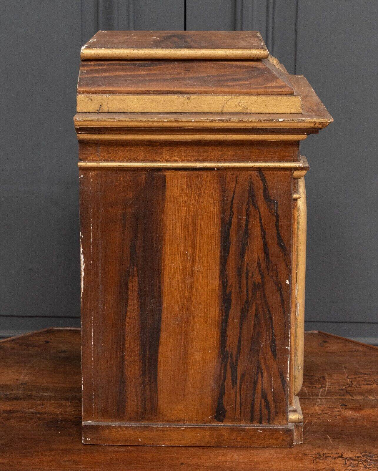 18th century tabernacle decorated with 2 columns and a sun on the facade