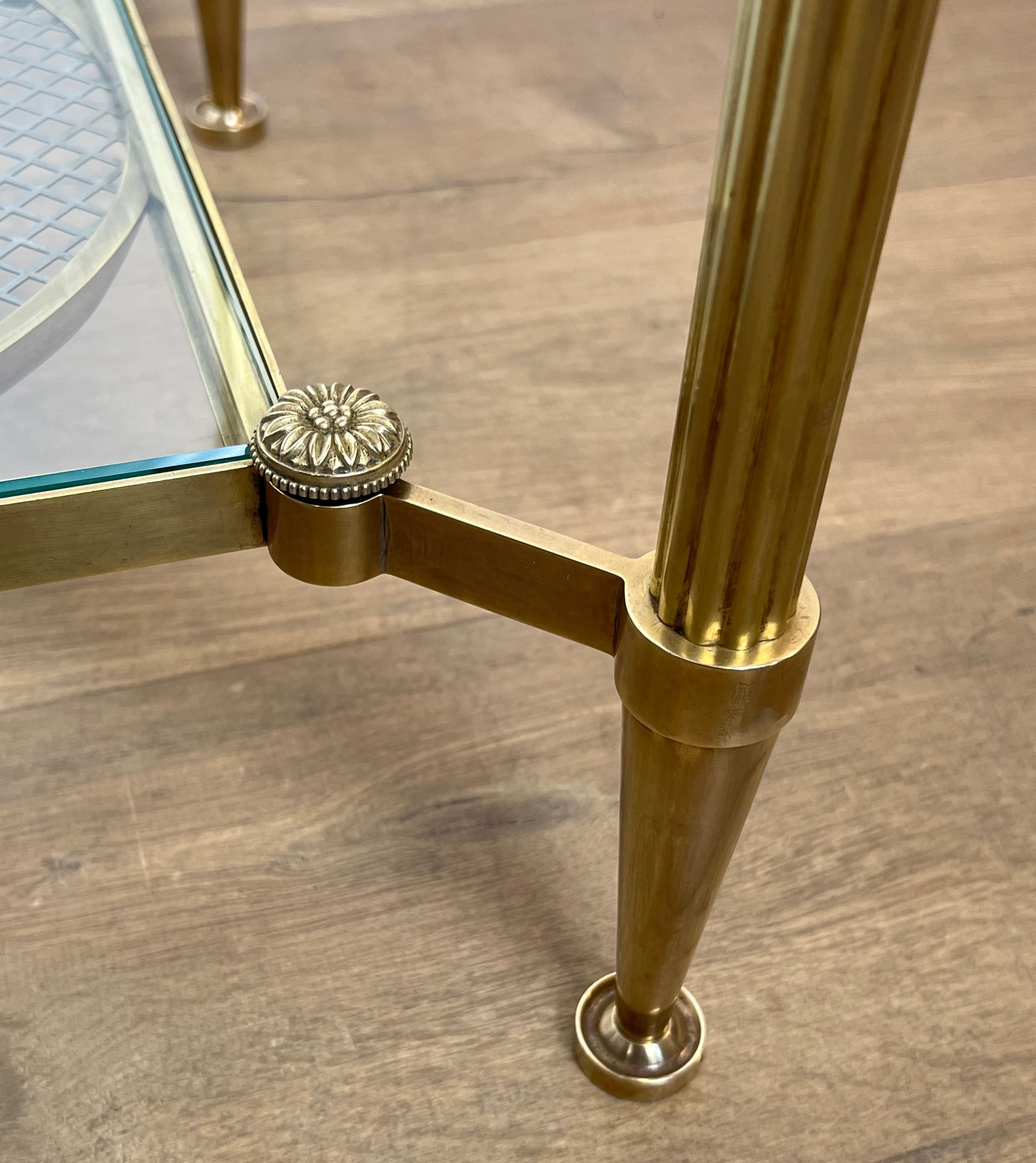 Rare bronze, brass, and steel mesh coffee table with a double glass top resting on a brass mesh. French work by Jansen