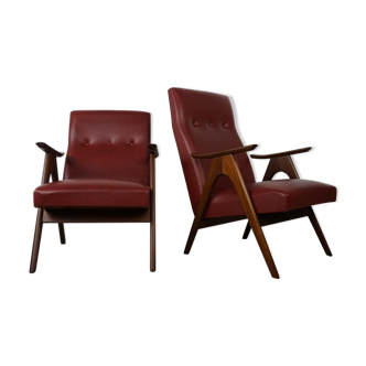 Paire de fauteuils années 50 design Louis Van Teeffelen en teck et simili cuir bordeaux