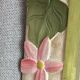 Carved wooden mirror, colourful floral decoration.
