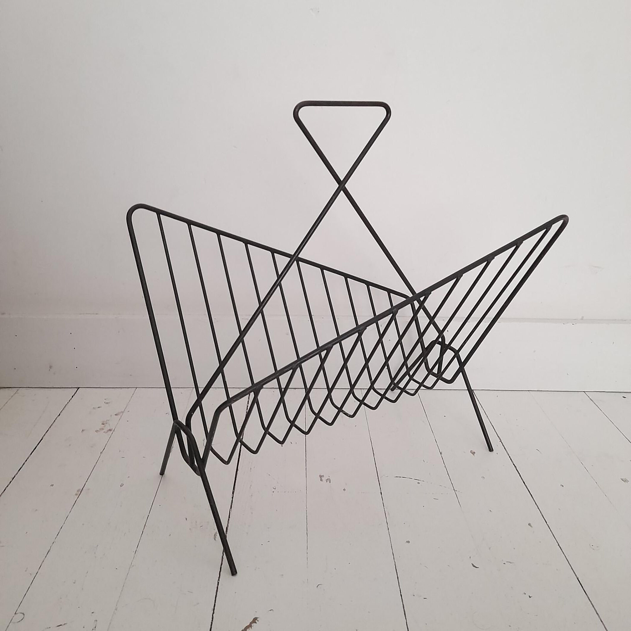 Vintage wrought iron newspaper rack from the 60s