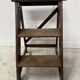 Library step stool with three steps in patinated beech, 20th century.