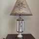 Large pagoda lamp painted with floral patterns and metal shade.