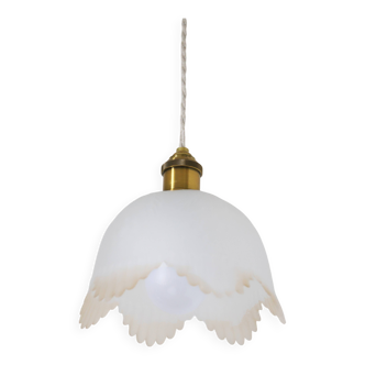 Frosted glass pendant light with floral patterns and wavy edge
