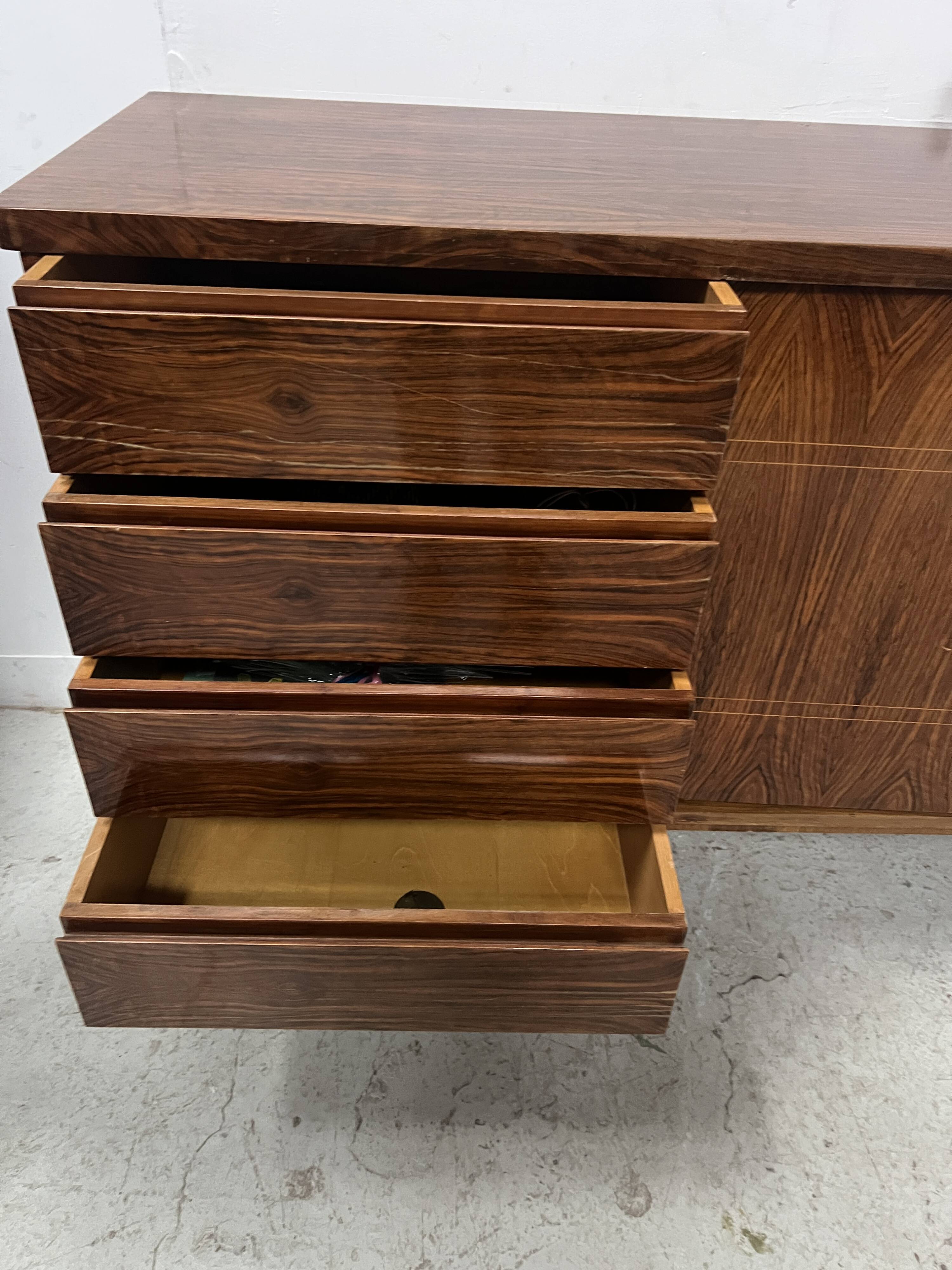 Scandinavian enfilade in veneered wood with iron legs, 20th century.