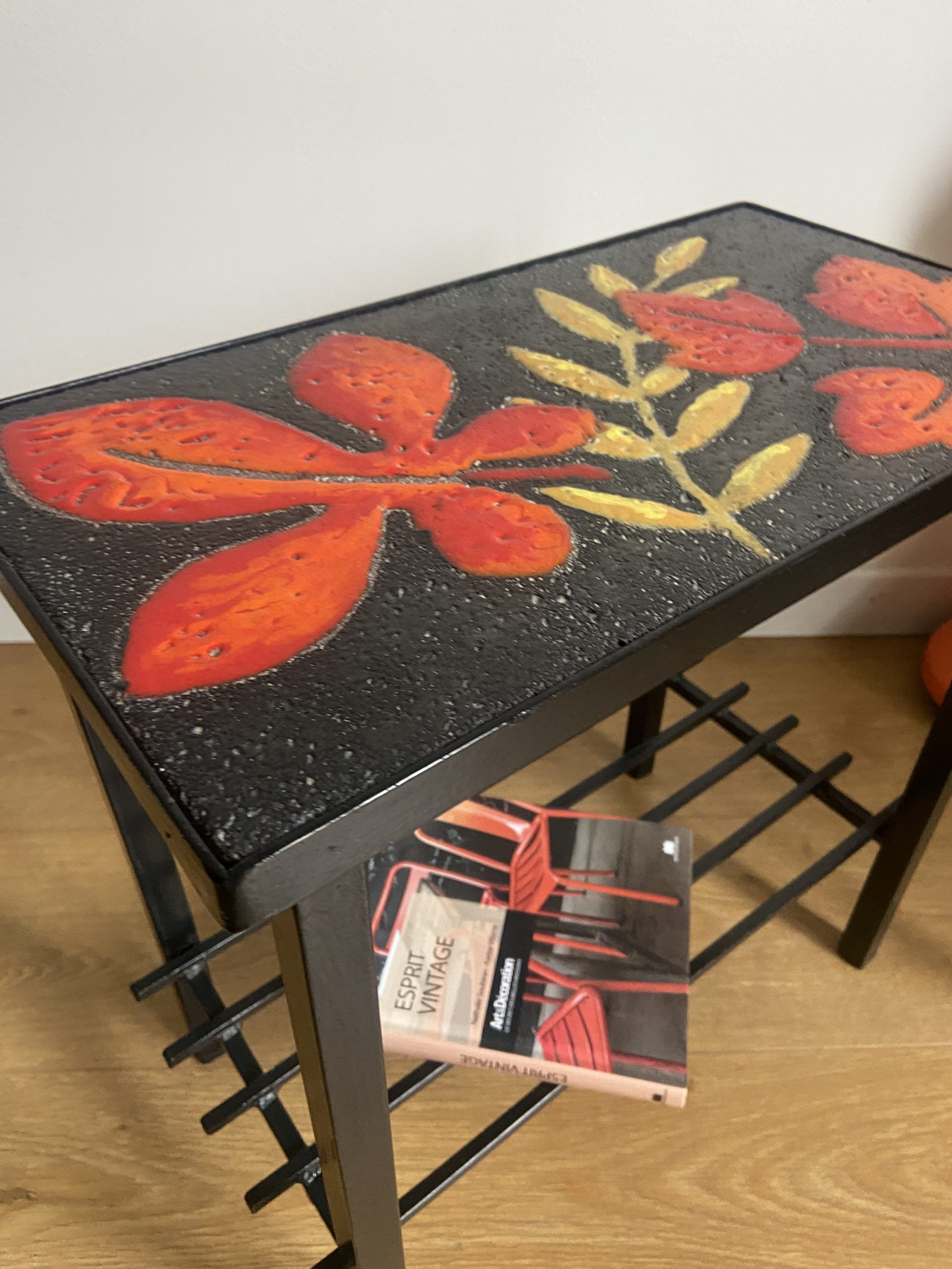 Side table or end of sofa in wrought iron and enamelled lava stone circa 1960