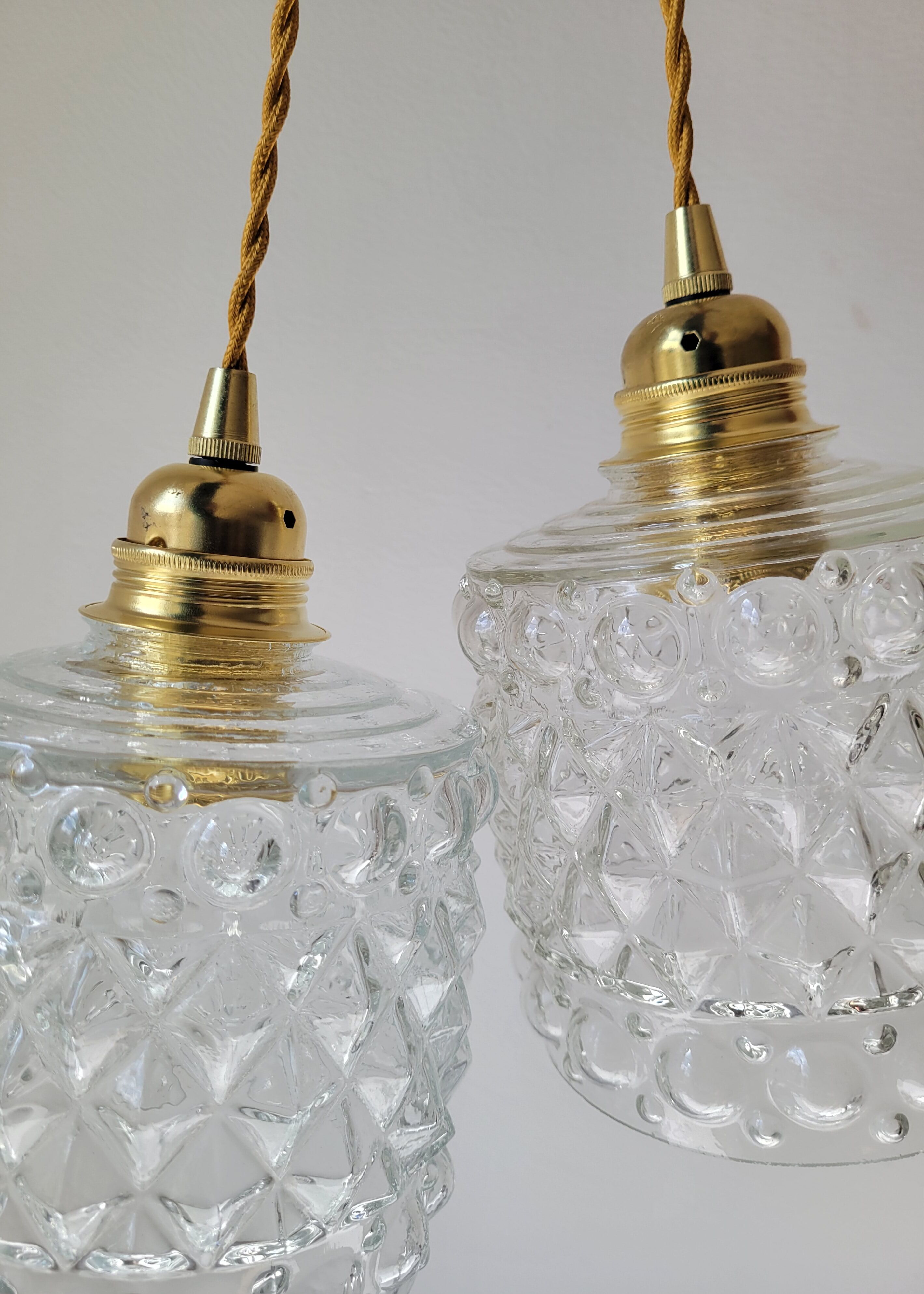 Duo of molded glass pendant lights