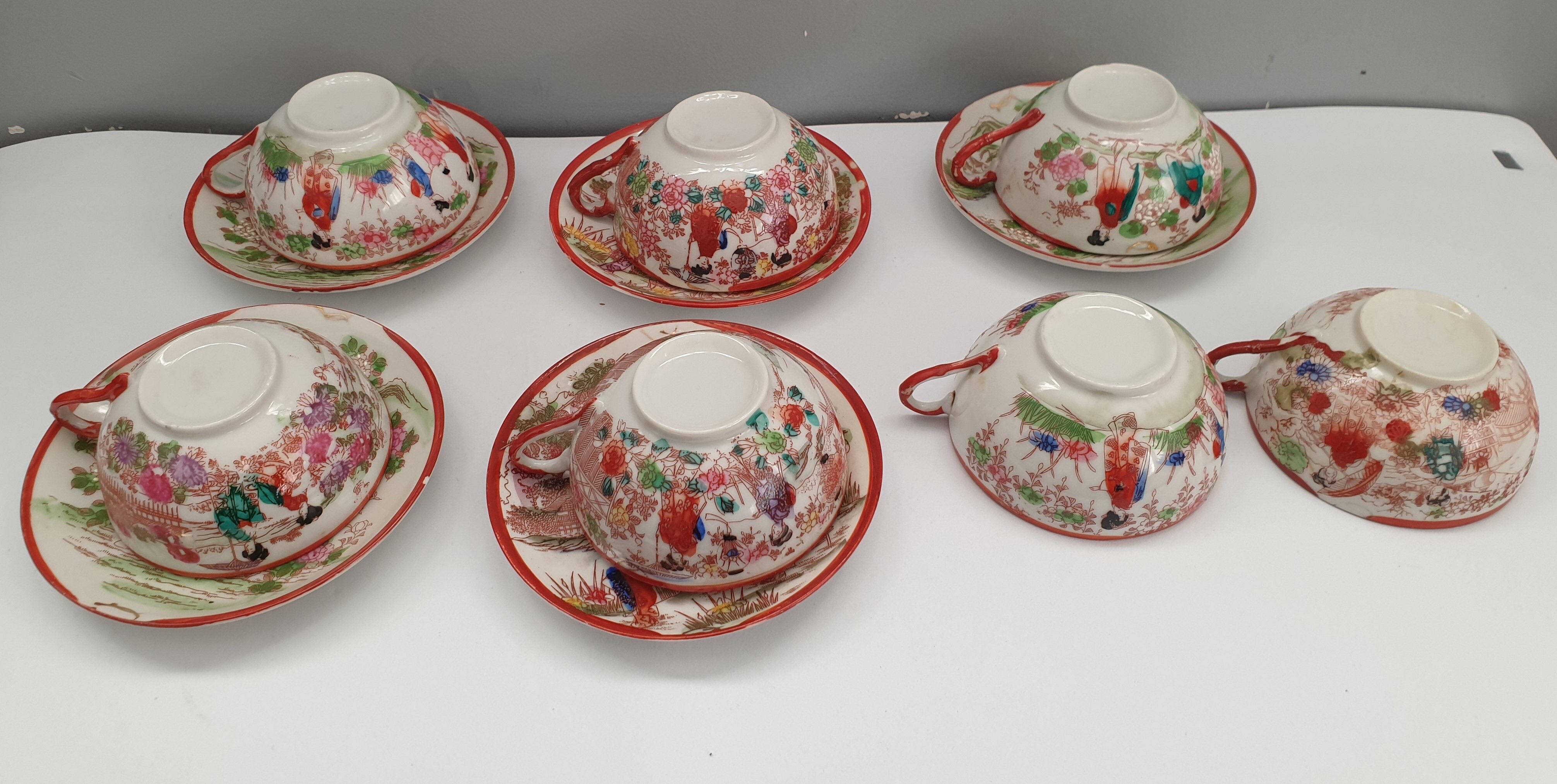 Set of seven tea cups and five sub-cups made of Japanese porcelain