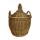 Old demijohn in her wicker basket