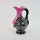 Black and pink Vallauris carafe with white relief patterns