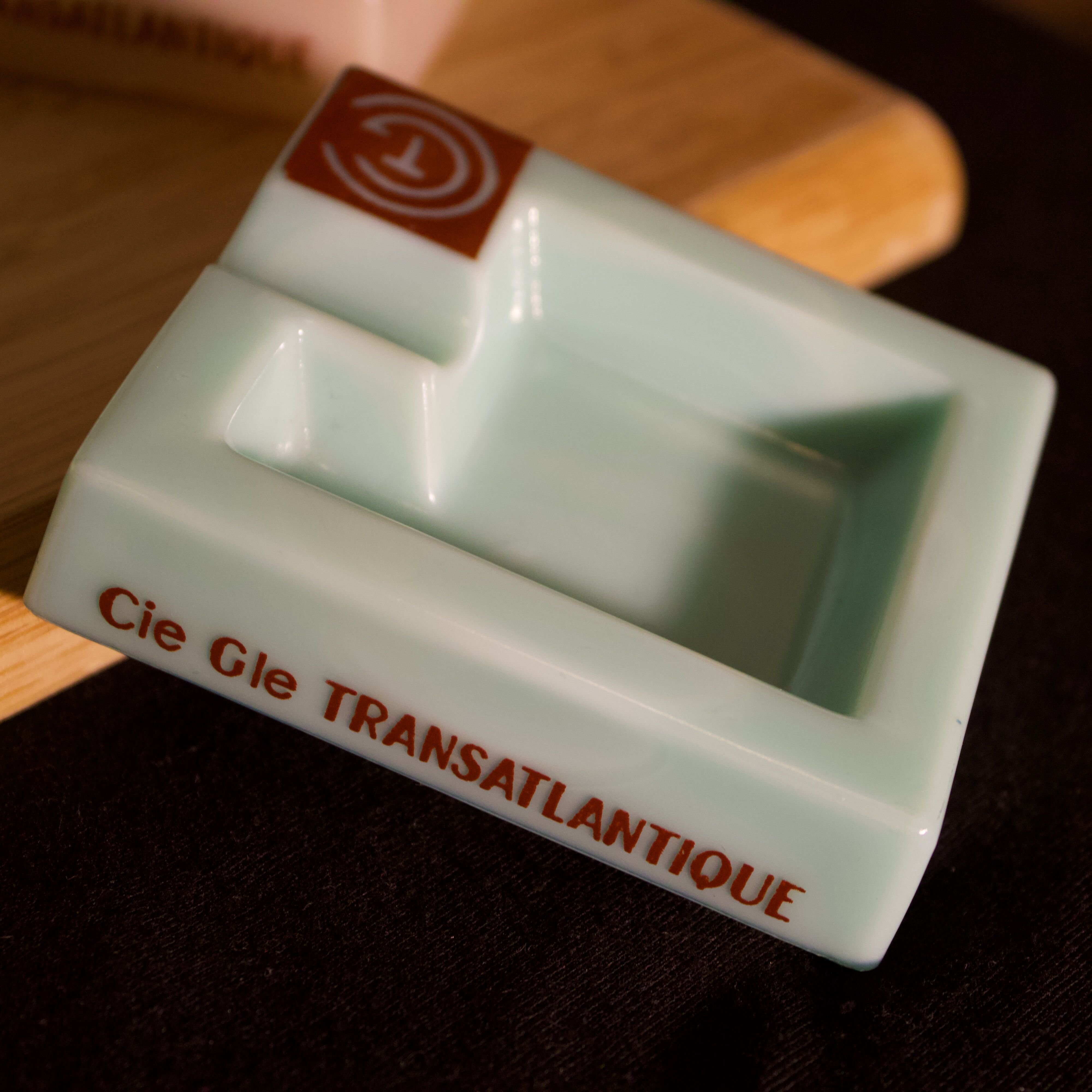 Three opalex ashtrays at the Logo of the Trans-Atlantic General Company - French Line - Model created by Jean Luce for the cruises of the liner Normandy and France