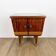 1950s bedside table in varnished wood veneer and brass.