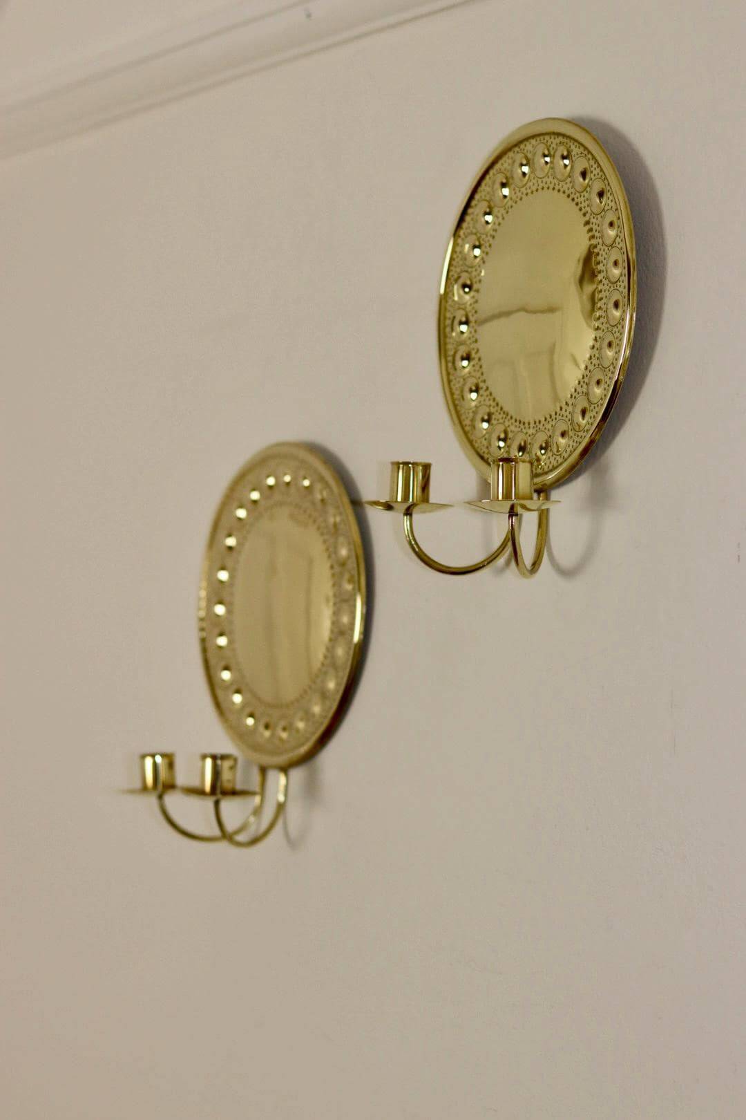 A pair of Swedish brass wall lights from the 1970s.