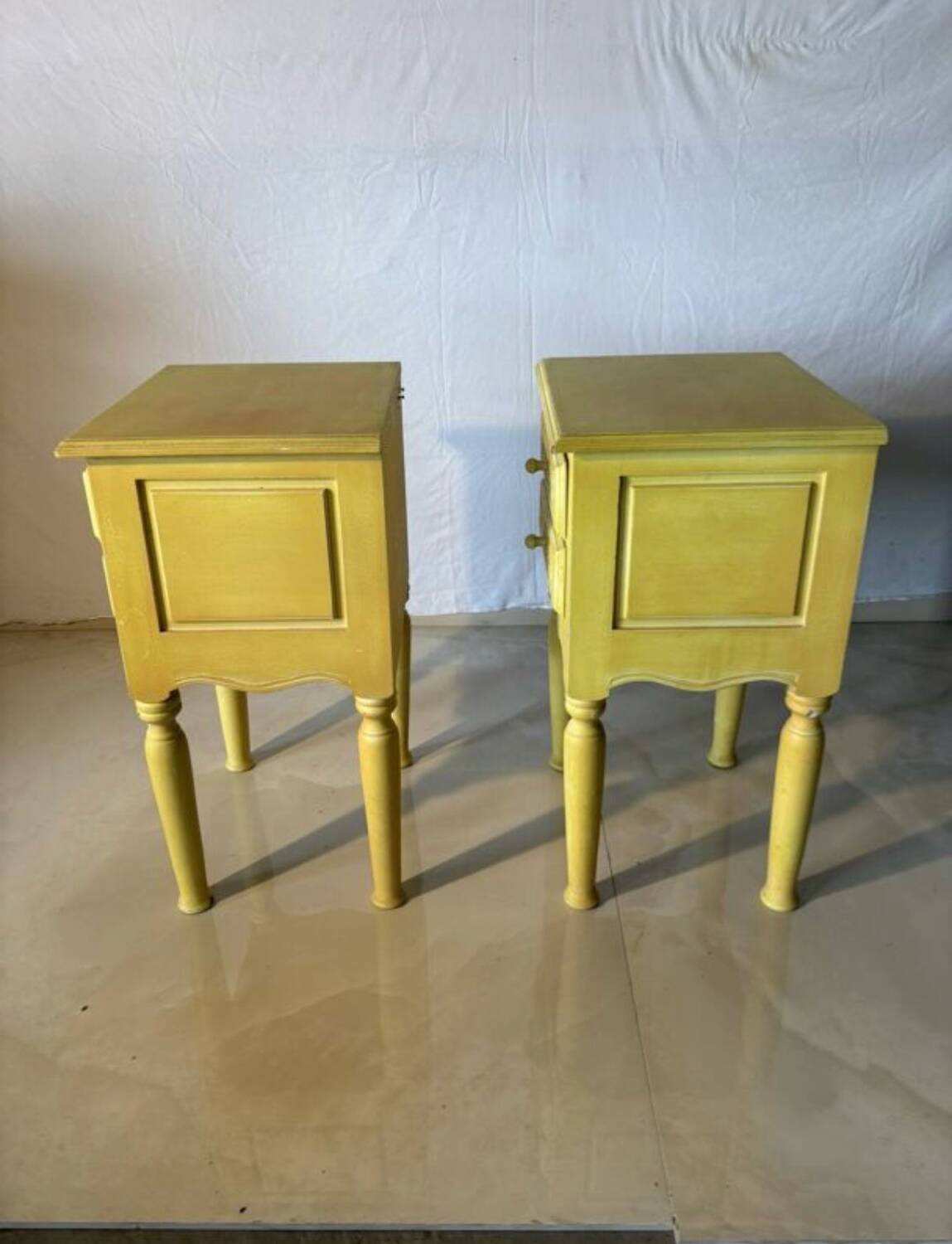 Pair of vintage carved wooden bedside tables.