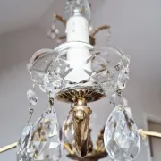 Antique chandelier with pendants, in bronze and glass pendants.