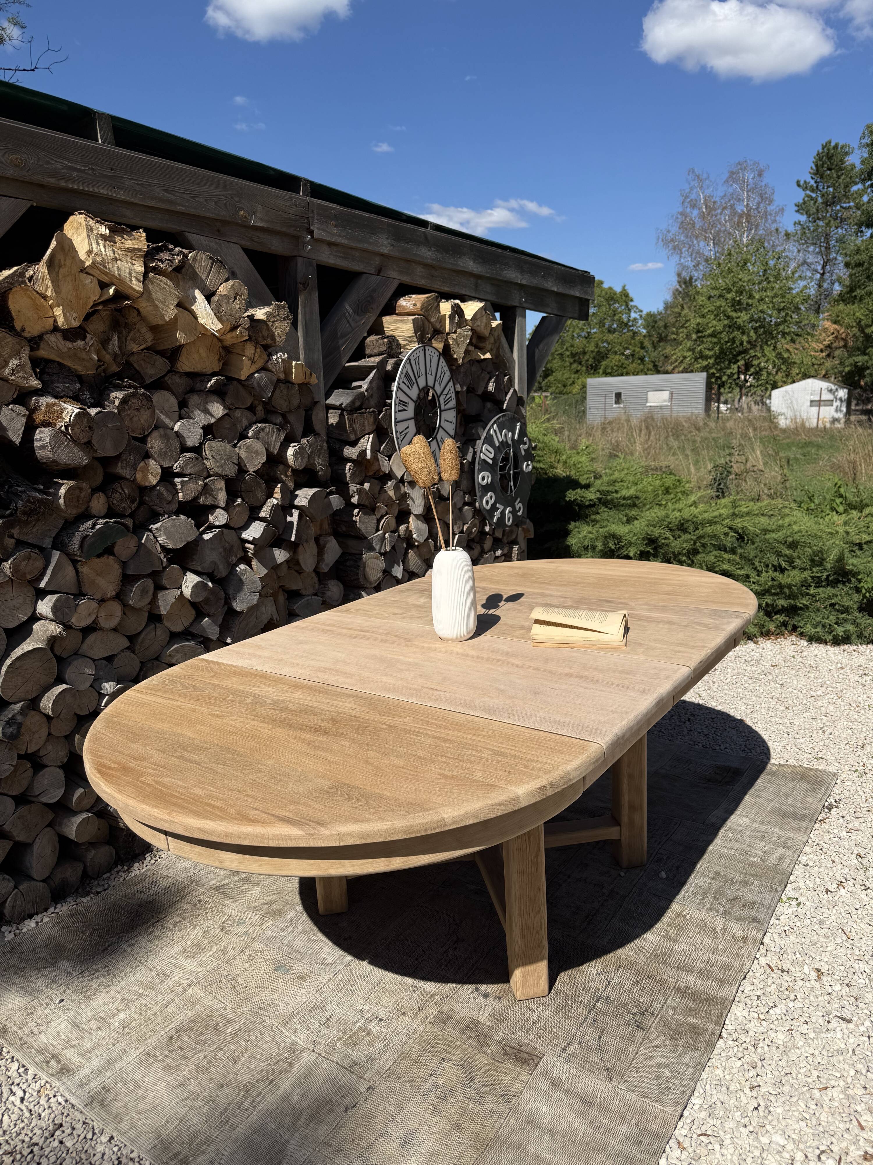 Round solid oak table with extensions, maximum 220cm.