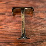 Golden sign letter “T”