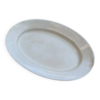 Large oval cream serving platter in ceramic - vintage model from the 1950s, wide rim.