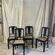 Black chairs and cannage