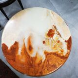 Round table / pedestal table in marble and gilded metal