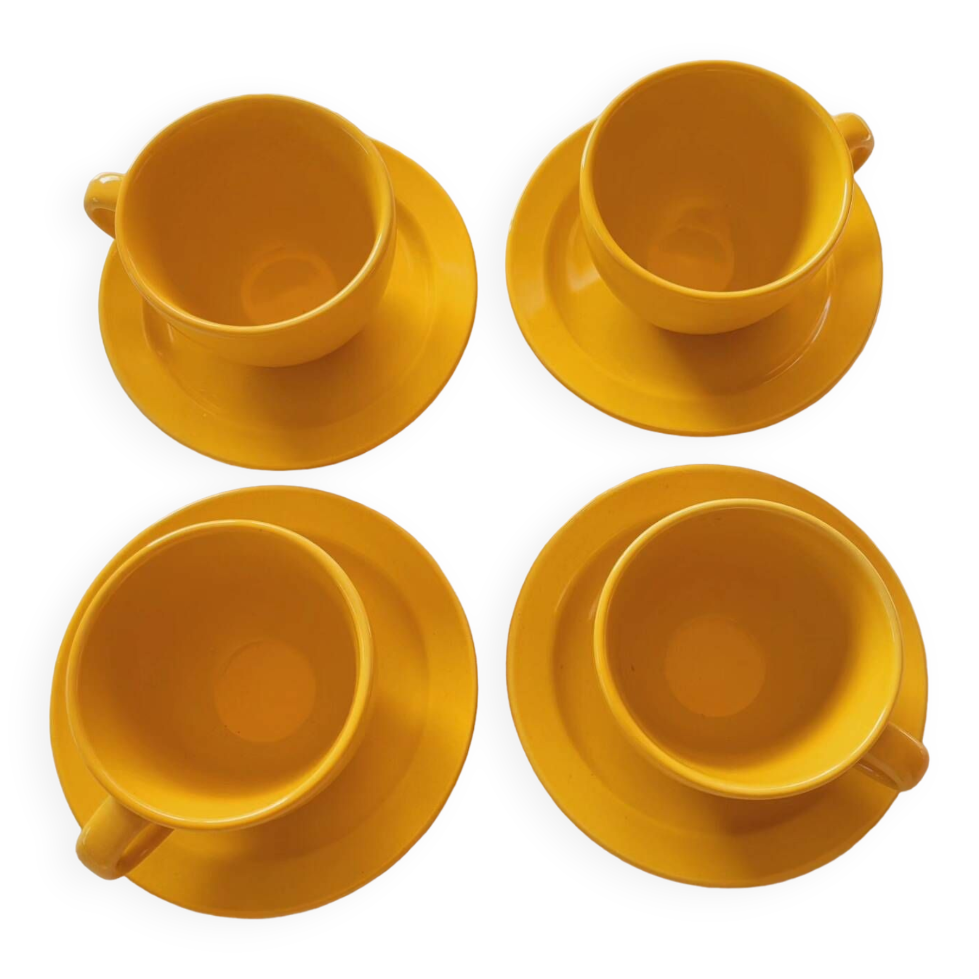 4 yellow cups and saucers