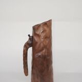 carved wooden pitcher