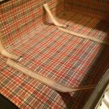 Suitcase vintage leather inside and brown carpeted home