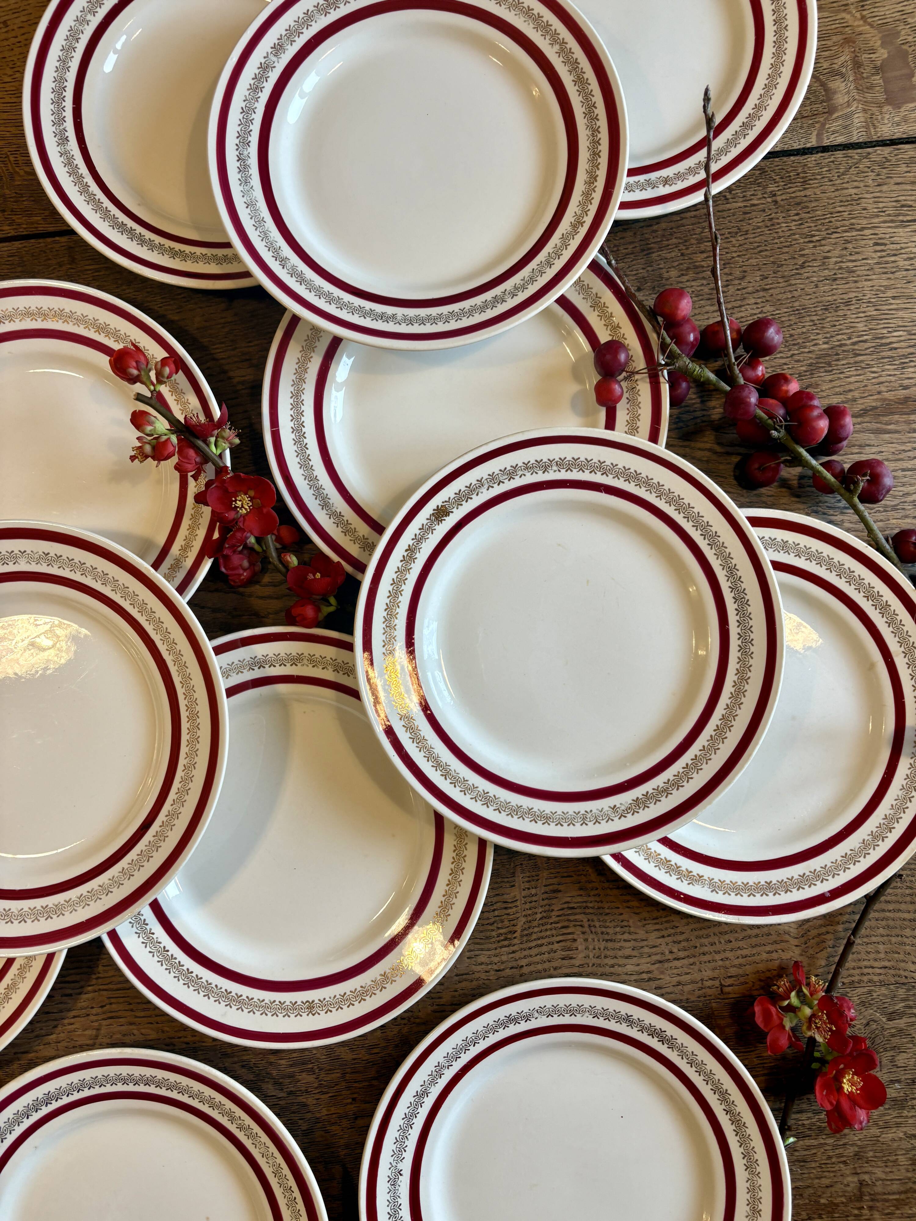 Set of 12 antique Gien red and gold dinner plates.