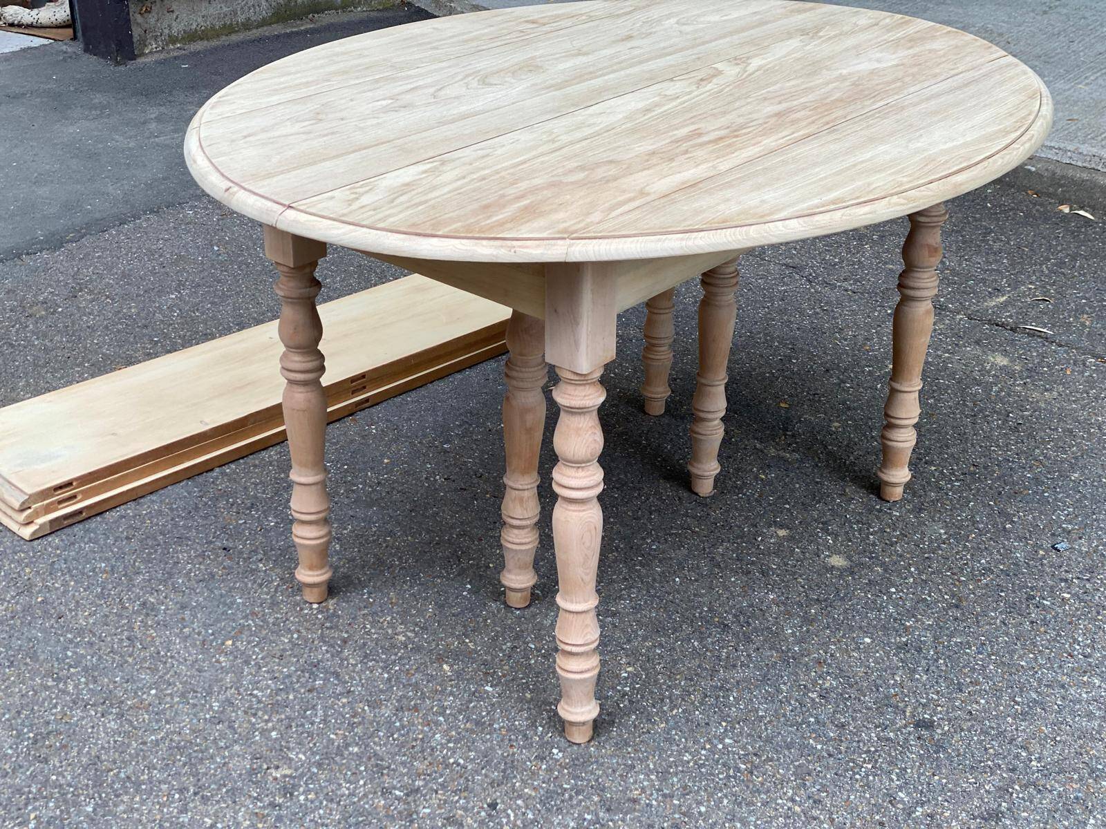 Renovated Louis Philippe round extendable dining table with flaps and 3 extensions.