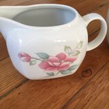 Vintage porcelain coffee or teapot with milk jug