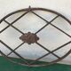 Grille ovale décorative en fer forgé début XXème