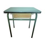 Child in formica desk