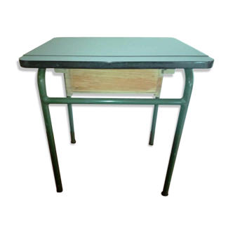 Child in formica desk