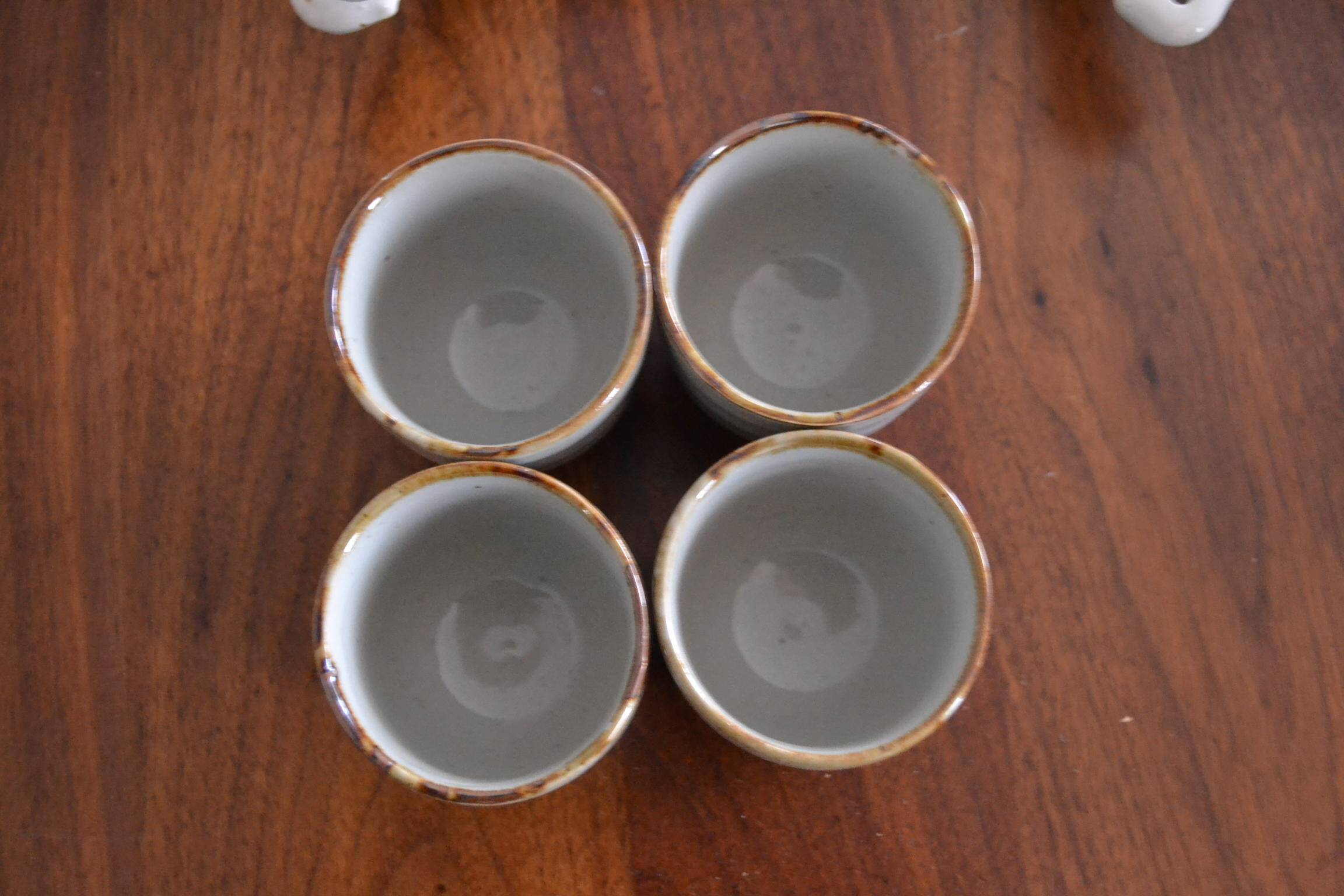 Set of 4 small stoneware tea bowls.