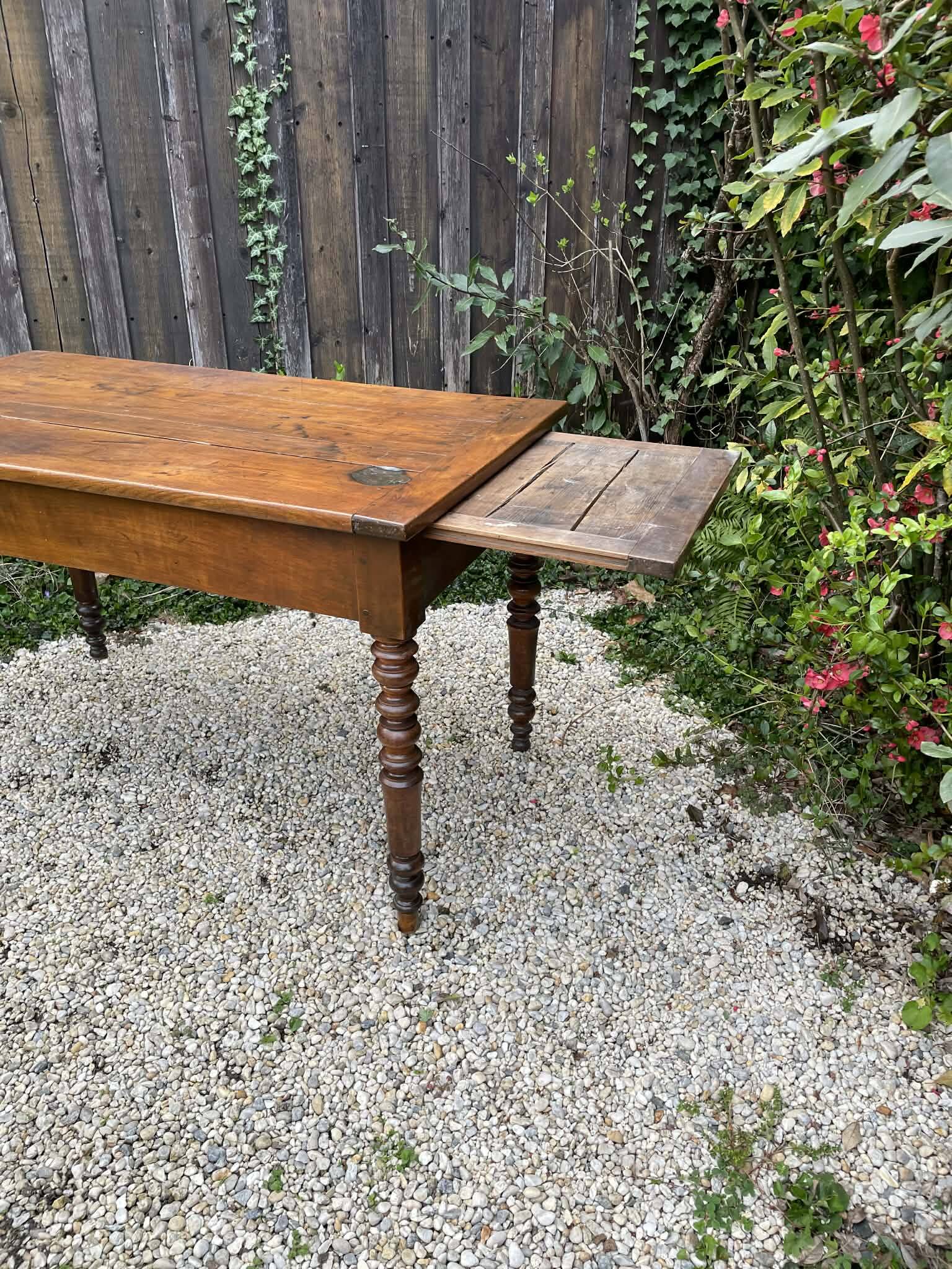 Old kitchen table with chopping board.