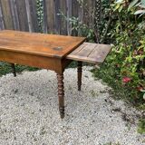 Old kitchen table with chopping board.