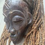 Chokwe Mwana Pwo mask in carved wood with a dark patina and rope hair