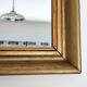 Antique mirror in gilded and copper wood