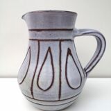 Vintage pitcher in enamelled earth