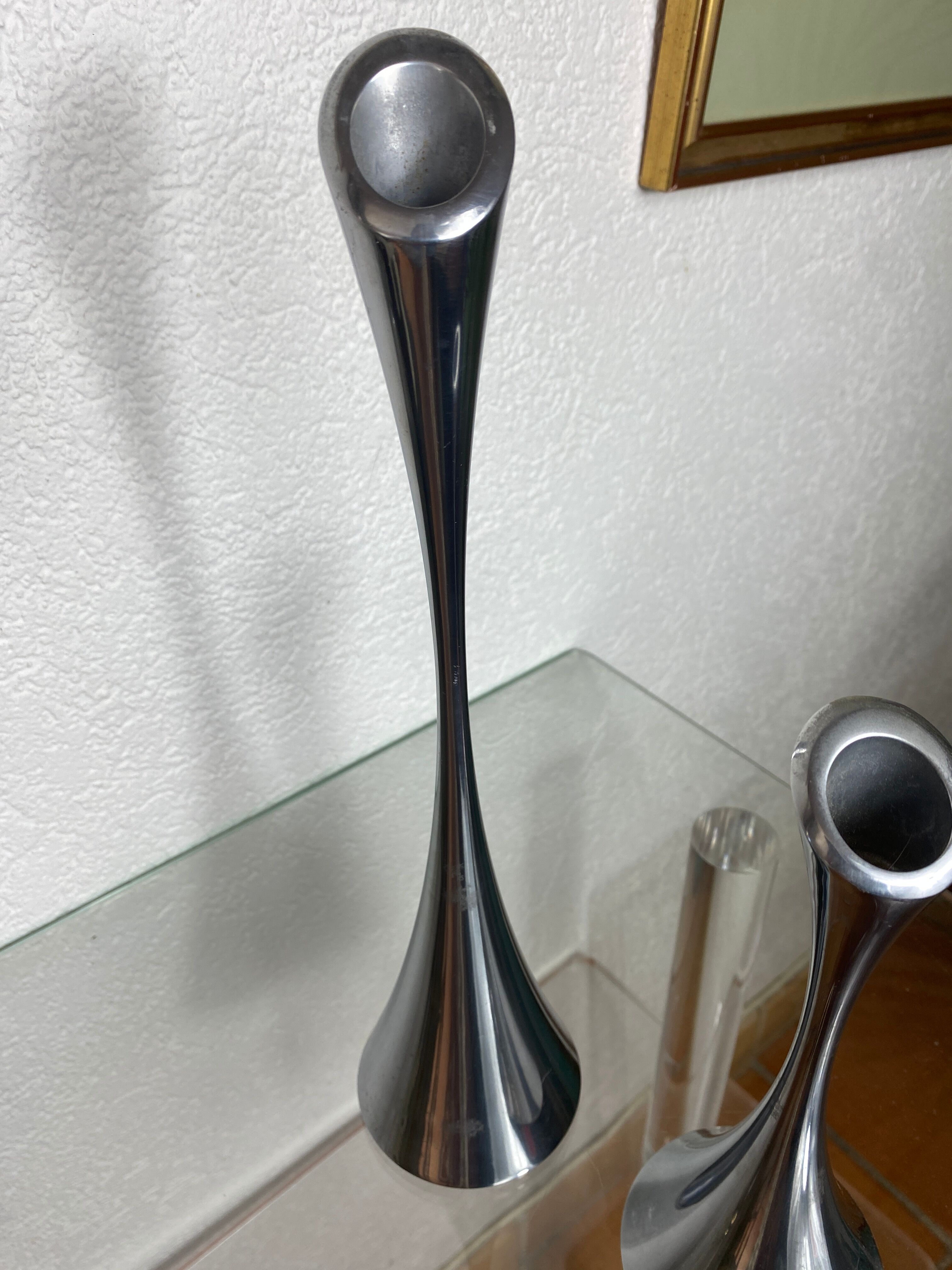 Pair of designer candle holders in stainless steel