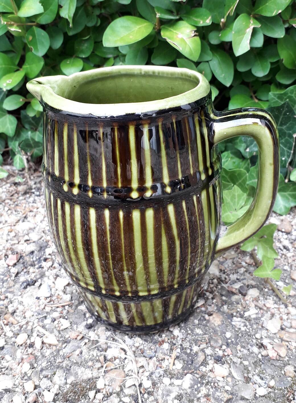 Green and brown ceramic jug