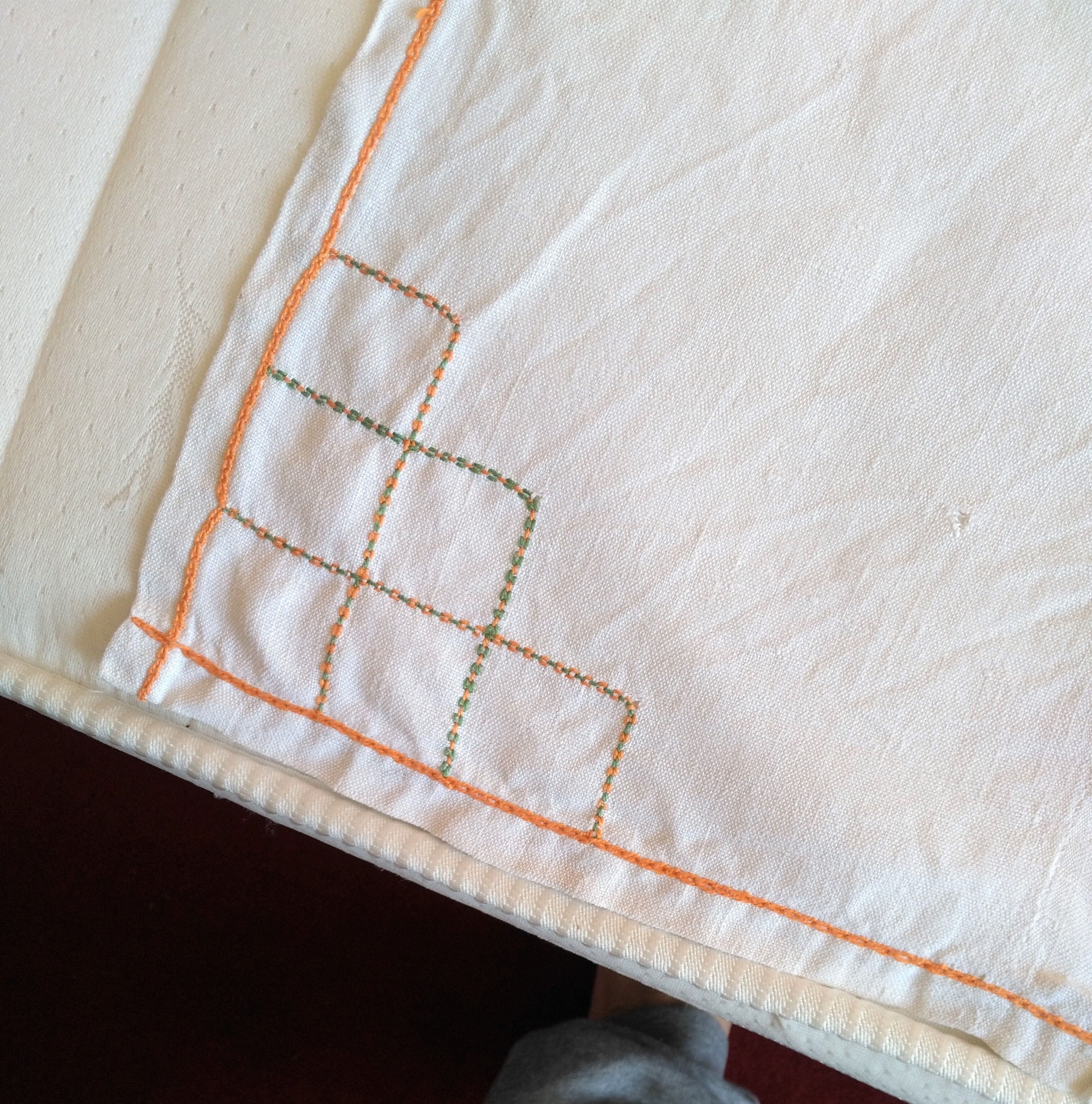 Antique linen tablecloth embroidered with flowers